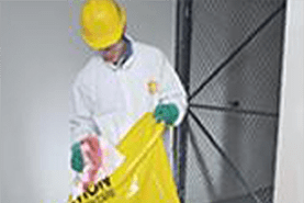 Worker Wearing a Helmet Holding a Bag